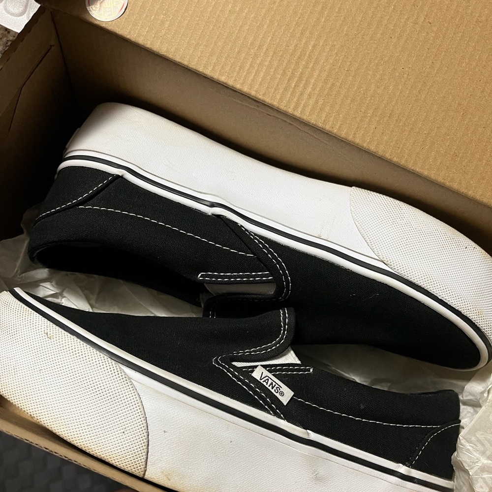 Vans Men's Black and White Slip-On Sneakers